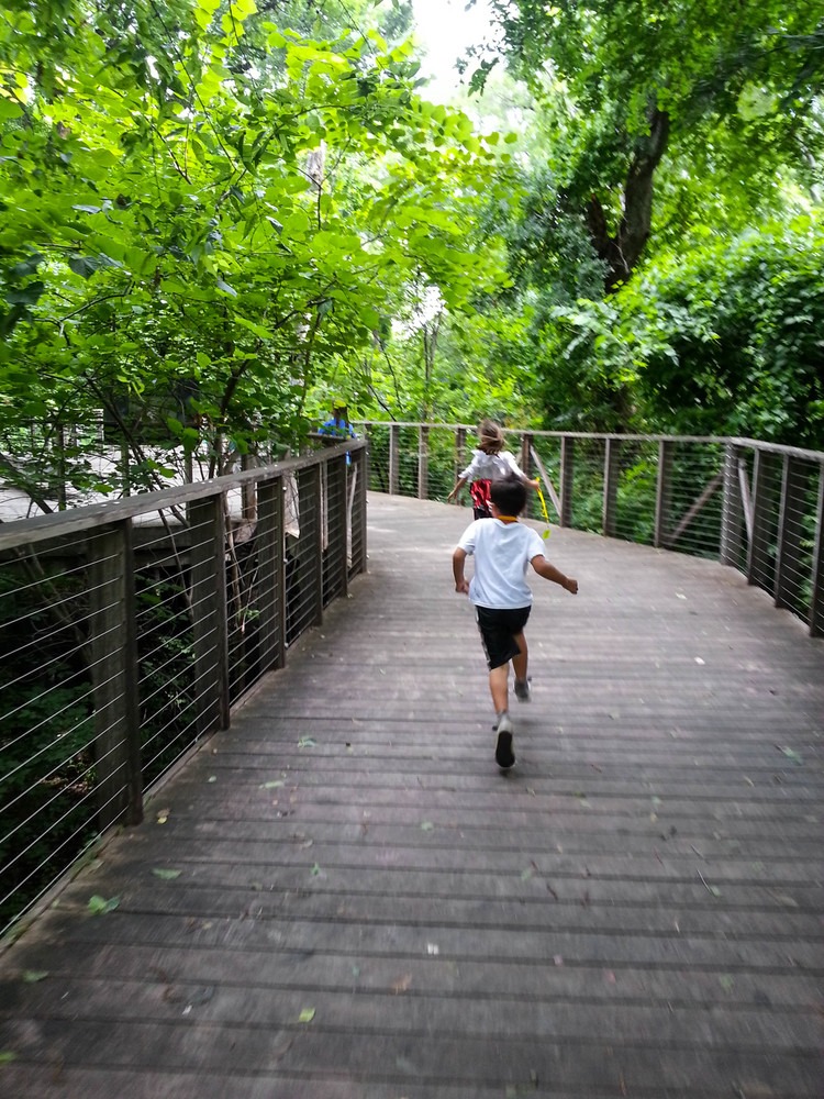 Child running through Native Texas Boardwalk