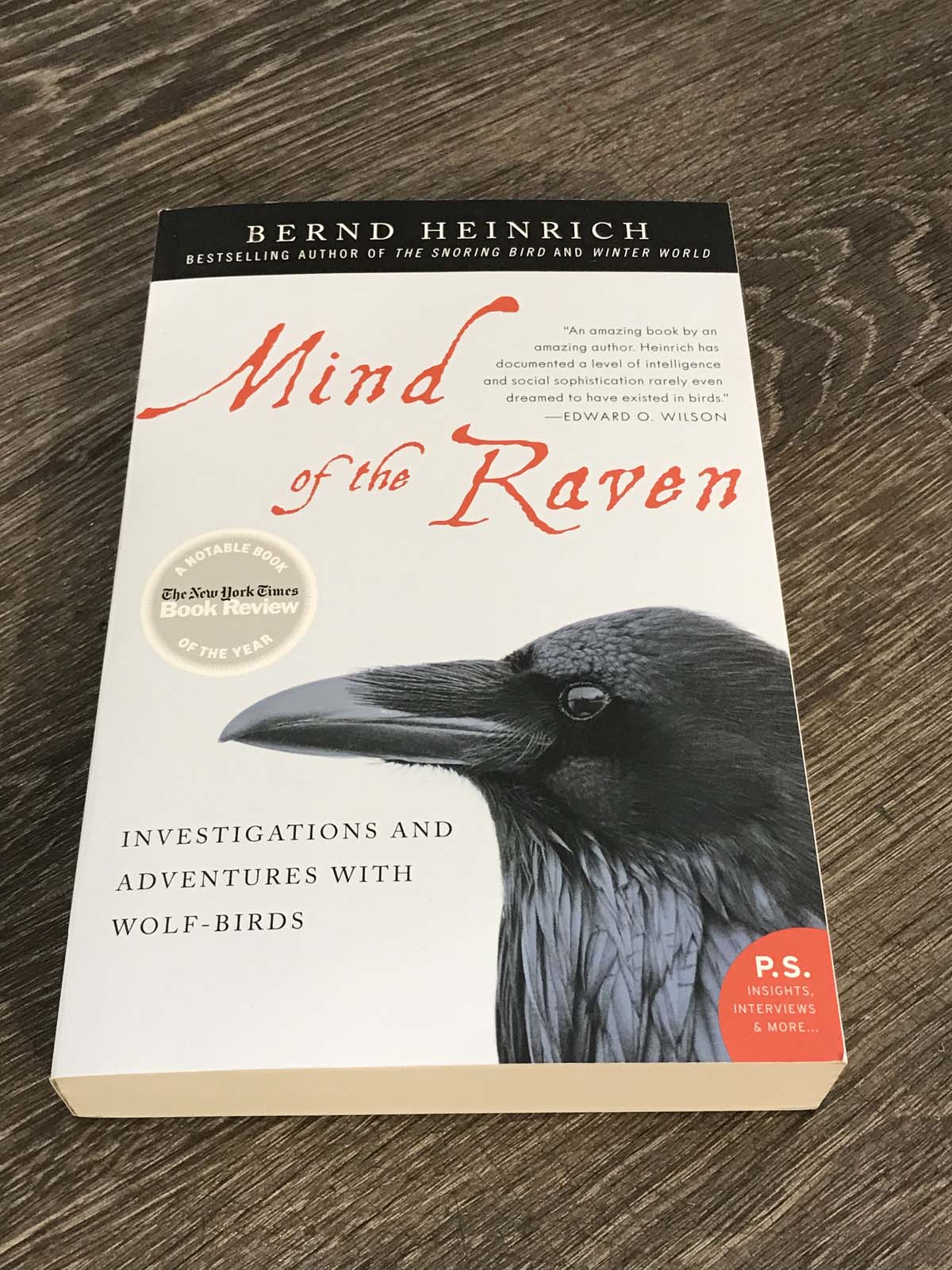 Book cover for Bernd Heinrich's Mind of the Raven. A raven is featured at the bottom right of the book cover.
