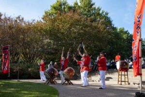 Taiko drummers in red perform at the Japanese Garden Festival
