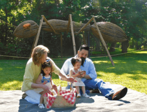 Family enjoying picnic near Big Bugs ant