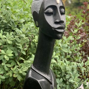 Black stone carving of the head of a woman from ZimSculpt