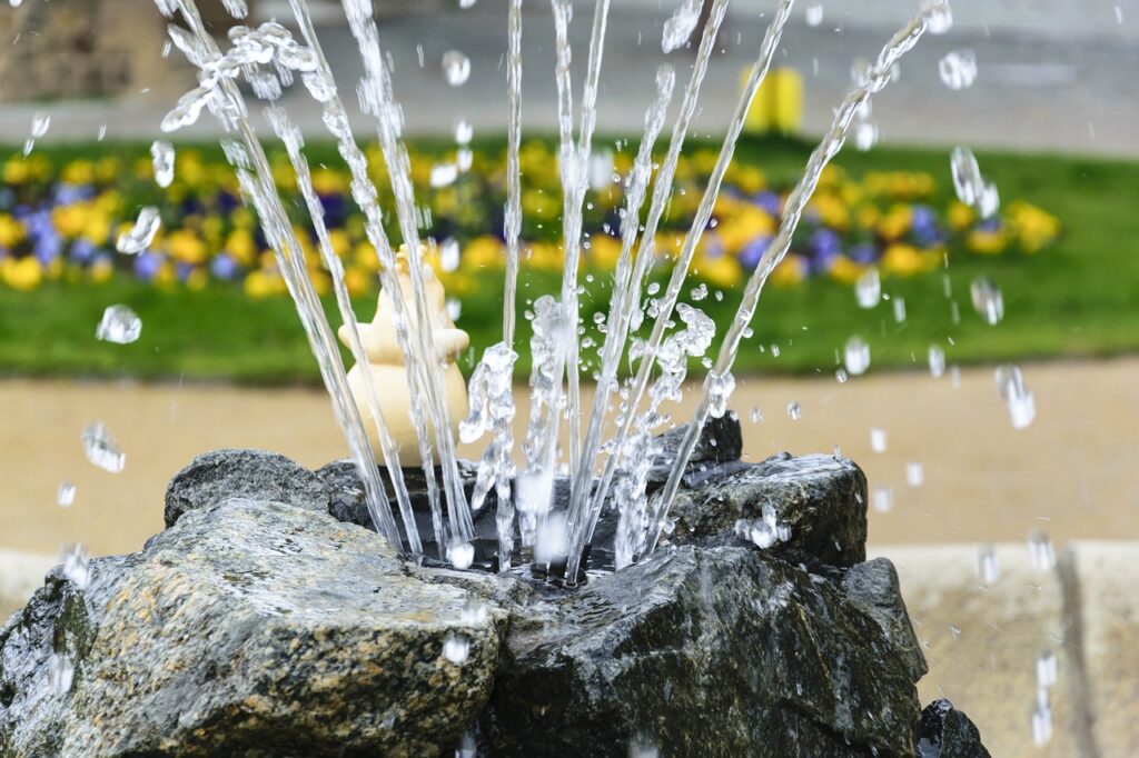 Spray of water from an outdoor fountain