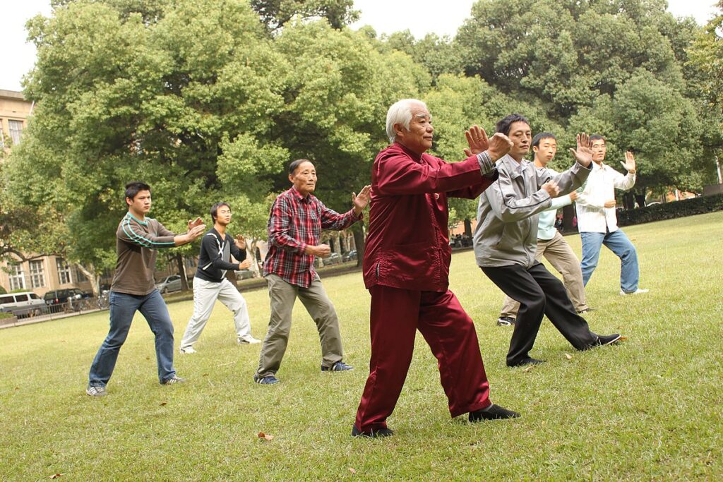 Group of students practice tai chi