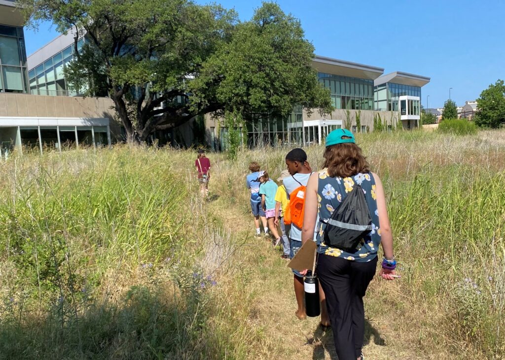Kids explore the Prairie at summer Camp in the Garden