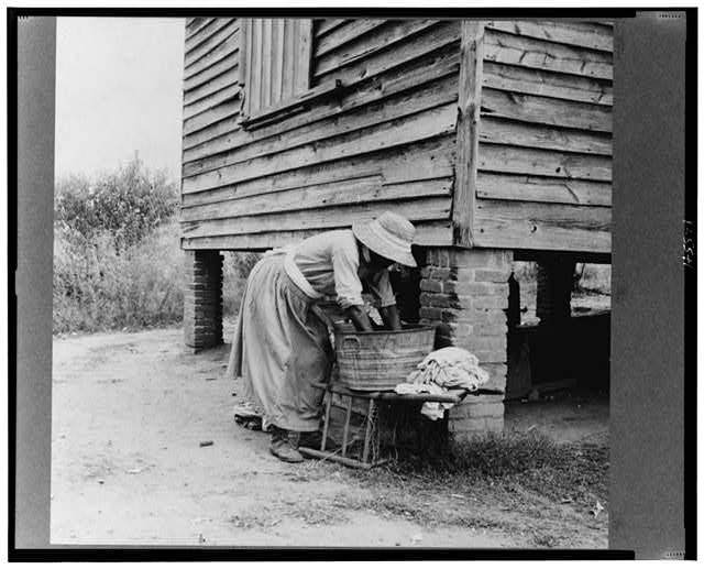 Lange, Dorothea, photographer. Caroline Atwater, wife of Negro owner, has a well-swept yard. United States Orange County North Carolina, 1939. July. Photograph. https://www.loc.gov/item/2017772205/.